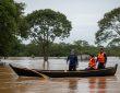 Campsite by flooded river after heavy rains in Brazil