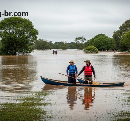 Campsite on higher ground beside a flooded river in Brazil, with tents pitched above water and protective gear visible.