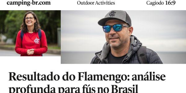 Torcedores de Flamengo montando acampamento próximo a um estádio ao pôr do sol, com cores do clube e equipamentos de cam